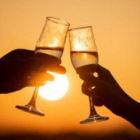 glasses of champagne against the sun, romantic evening